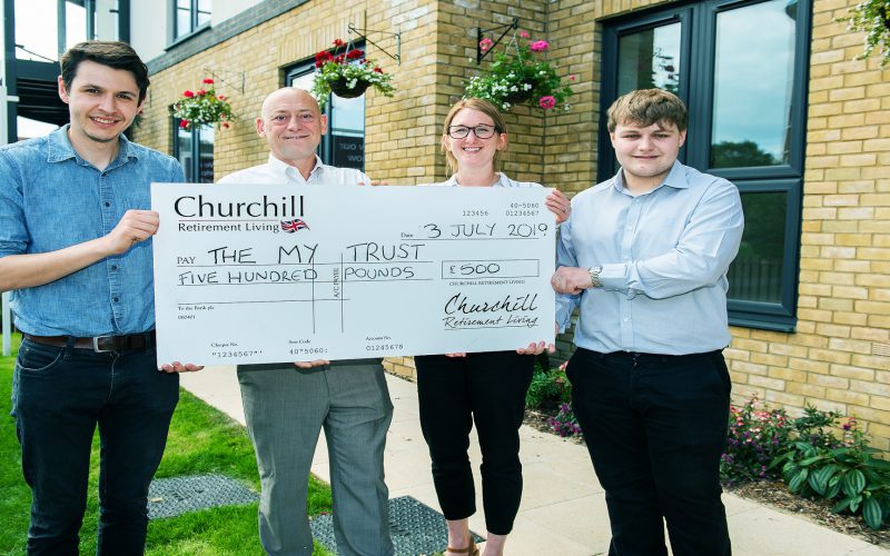 Churchill Site Manager Kevin Rowland second from left presents cheque to MY Trust 2